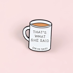 Minimalist enamel coffee mug pin badge featuring That's What She Said text on pink