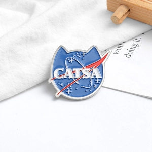 Creative CATSA enamel pin with cat ears design inspired by the classic NASA logo