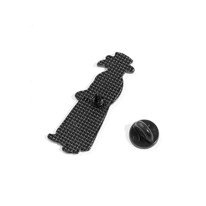 Detailed back view of black enamel crow brooch with textured metal and rubber clutch