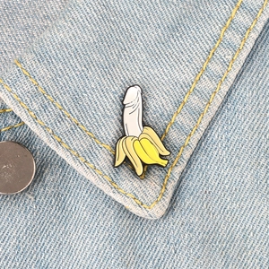 Creative enamel banana brooch with suggestive inner design on denim collar jacket