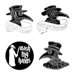 Set of four plague doctor enamel pins with classic black and white raven doctor masks