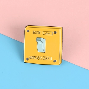 Creative yellow power switch enamel pin with Book On World Off text on split background