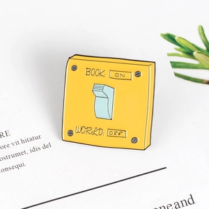 Creative yellow square enamel pin featuring ON OFF switch design for book lovers