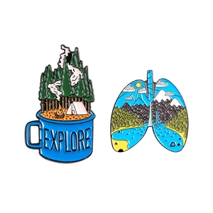 Outdoor adventure enamel pins set featuring explore mug and nature lung designs