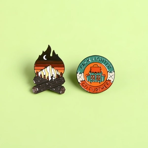 Outdoor camping enamel pin set featuring campfire mountains and backpack badges