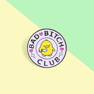 Detailed view of Bad Bitch Club enamel pin with cartoon chicken and heart patterns