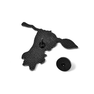 Detail of black enamel pin back with textured metal finish and rubber clutch fastening
