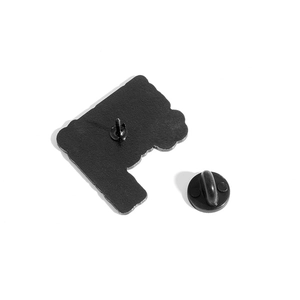Creative physics pin back view showing matte black metal base and rubber clutch fastener