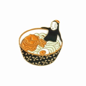 Detail of creative No-Face enamel pin featuring a Japanese ramen bowl design