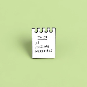 Minimalist enamel pin shaped like a notepad with To Do Be Fucking Incredible quote