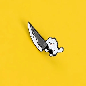 Cute cartoon white cat holding a large sword enamel pin brooch on yellow background