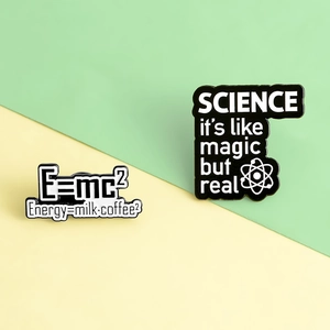 Detail of creative science pins with E=mc2 coffee formula and magic of science quote