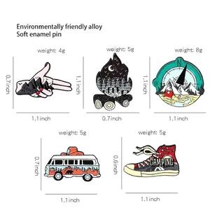 15-piece set of outdoor travel enamel pins with mountain and camping designs for backpacks