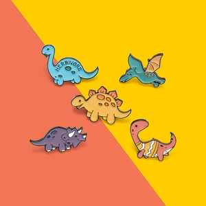 Detailed view of 5 colorful enamel dinosaur pins featuring Brontosaurus and Triceratops