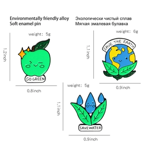 Three-piece eco-friendly enamel pin set featuring Save the Earth and Go Green themes