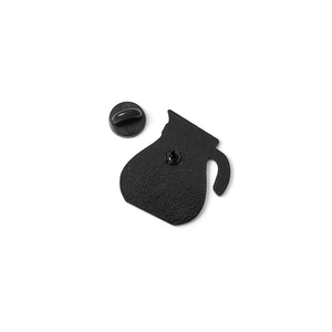 Detail view of the black enamel coffee pot pin back with matte texture and rubber clutch