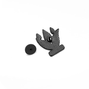 Detail view of the black alloy brooch back with anti-slip texture and rubber clutch