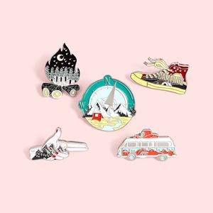 Five-piece outdoor camping enamel pin set with forest, van, and compass designs