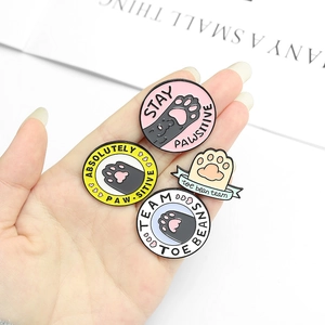 Set of four cute cat paw enamel pins featuring creative colorful cartoon metal badges