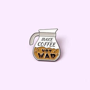 Coffee pot enamel pin featuring Make Coffee Not War text in creative cartoon style