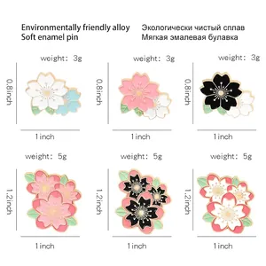 Enamel cherry blossom pin set in pink and white alloy for clothing and bags