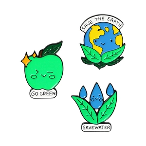 Three-piece eco-friendly enamel pin set featuring Save the Earth and Go Green motifs