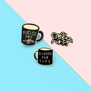 Three-piece coffee enamel pin set with gold and black finish on a pastel background