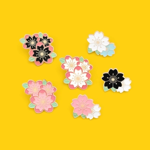 Cute Japanese cherry blossom enamel pins set in various colors with gold metal edges