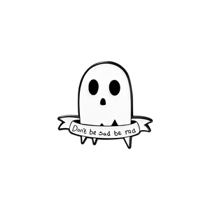 Detail shot of ghost enamel pin with 'Don't be sad be rad' quote in black and white