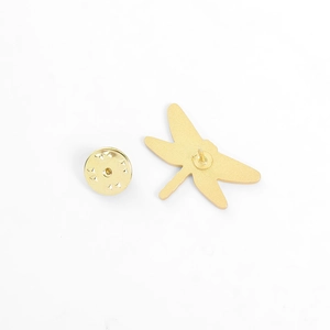 Detail of the golden dragonfly brooch back showing the pin and butterfly clutch fastener