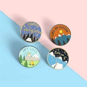 Outdoor camping themed enamel pins with mountain and forest motifs for backpacks