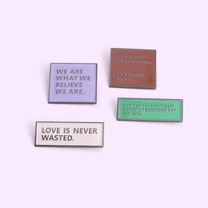 Minimalist enamel lapel pin set with geometric shapes and engraved inspiring English quotes
