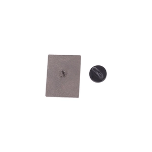 Back view of chemical equation alloy brooch featuring metal pin base and black rubber clutch