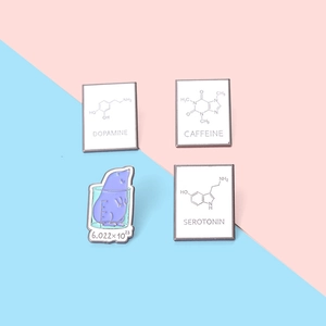 Set of 4 chemistry enamel pins featuring dopamine, caffeine, serotonin, and mole formulas