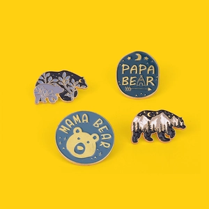Set of 4 Forest Bear Family enamel pins with Papa and Mama Bear designs on yellow background