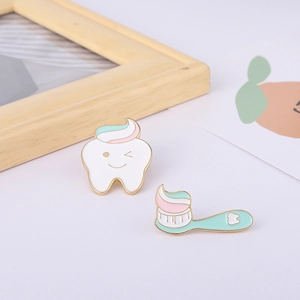 Cartoon tooth and toothbrush enamel pin set with gold trim for creative lapel decoration