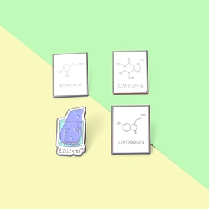 Science enamel pins set featuring dopamine caffeine and serotonin chemical formulas