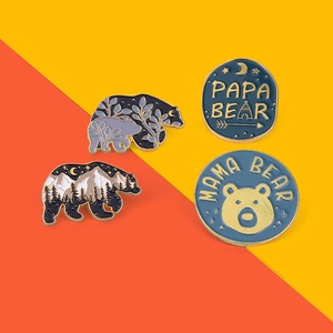 Detailed set of 4 enamel pins featuring forest bear silhouettes and Papa Mama Bear text