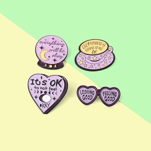 Enamel pins set with coffee cup and crystal ball shapes featuring positive phrases