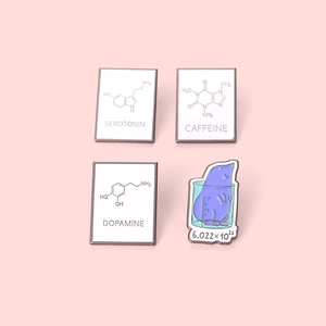 Set of four chemistry enamel pins with Serotonin, Caffeine and Dopamine formulas on pink background