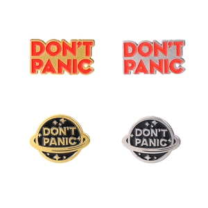 Don't Panic planet enamel pins set with red letters and cosmic circular metal badges