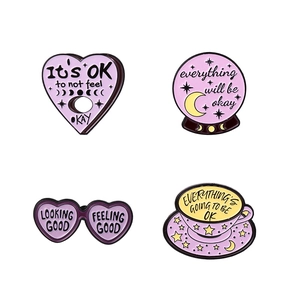 Set of 4 alloy enamel pins with motivational quotes and purple celestial designs