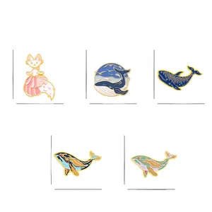 Five ocean-themed enamel pins featuring a cat and artistic whale designs in alloy