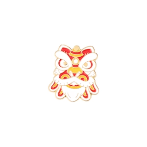 Detailed close-up of a festive Chinese lion dance enamel pin with red and gold details