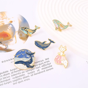 Creative alloy badges set featuring blue whales and a fox girl on magazine backdrop