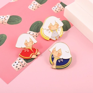 Close-up of colorful Sky Children of Light enamel pins on decorative pink paper