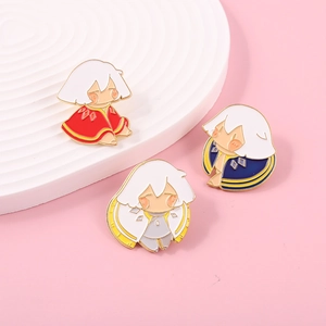 Three Sky Children of the Light enamel pins with colorful capes on pink background