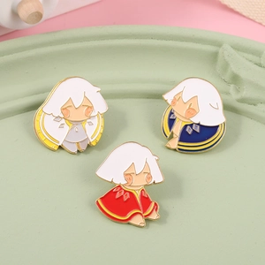 Detail of three colorful enamel pins featuring Sky: Children of the Light character capes