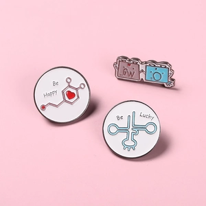 Cartoon science enamel pin set with chemical formulas and Be Happy motivational text