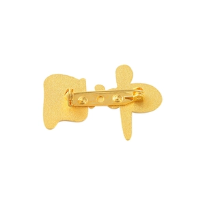 Golden cat shape enamel brooch with secure safety pin clasp on a white background